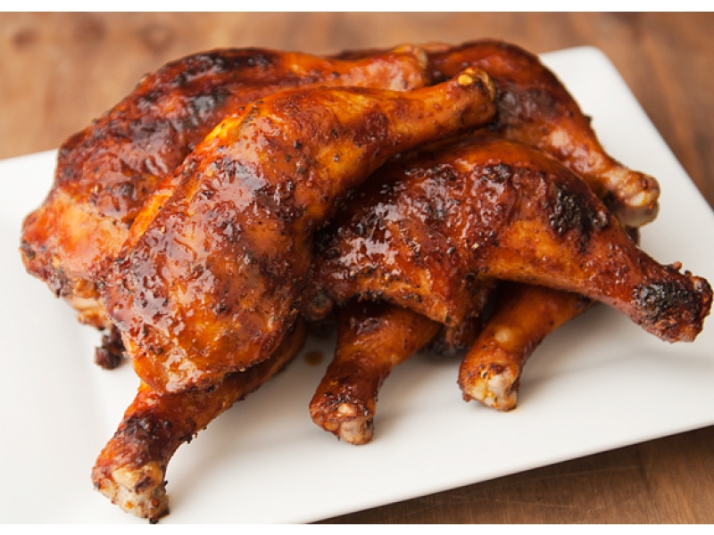 Orange Glazed Chicken Bottoms with one Free Side Dish